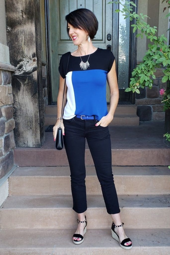April from Stunning Style showing you how to find your style wearing a color block top with black cropped pants.