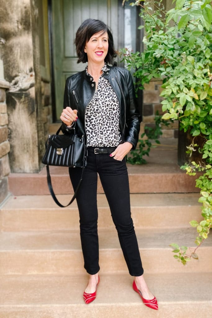 April from Stunning Style wearing a leopard blouse and black leather moto jacket from an inspiration outfit.
