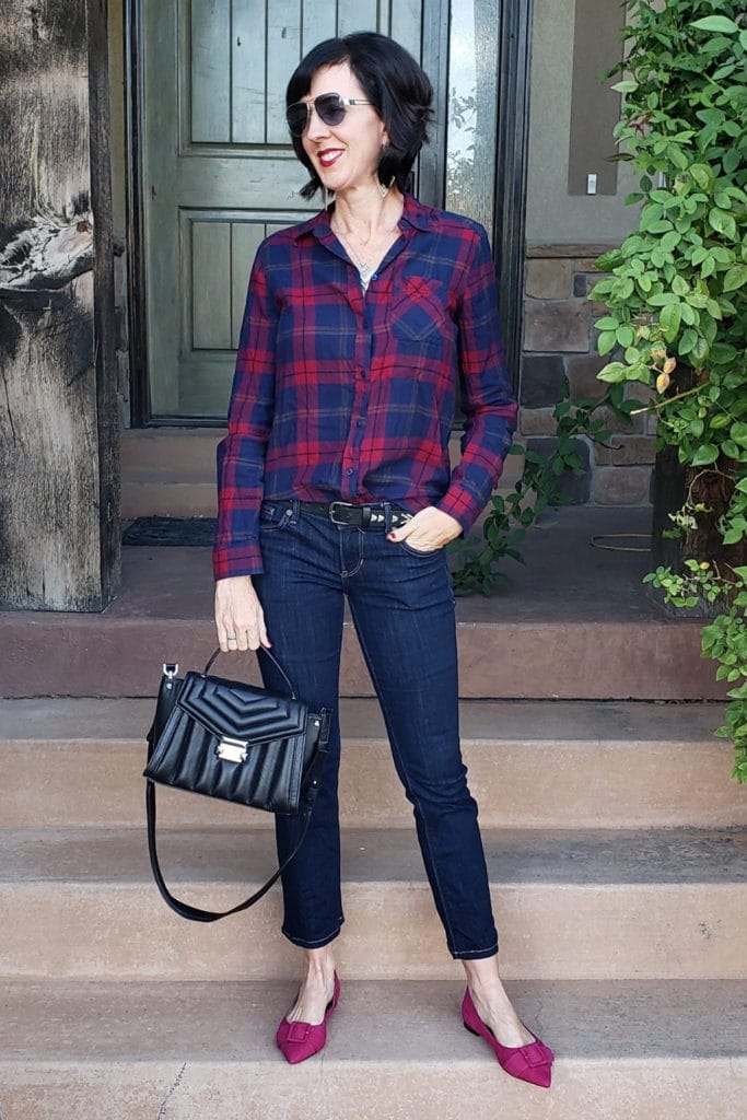 April from Stunning Style wearing a plaid shirt and jeans inspired by a fall outfit.