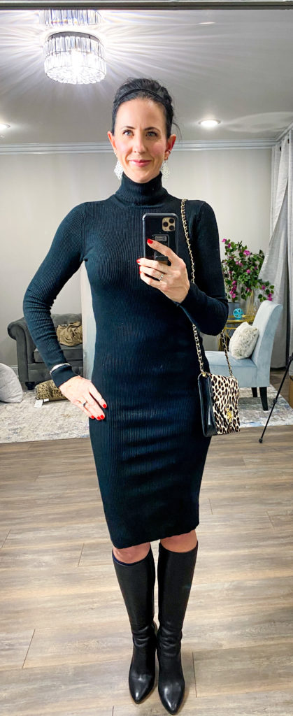 April from Stunning Style wearing a stylish black sweater dress and boots.