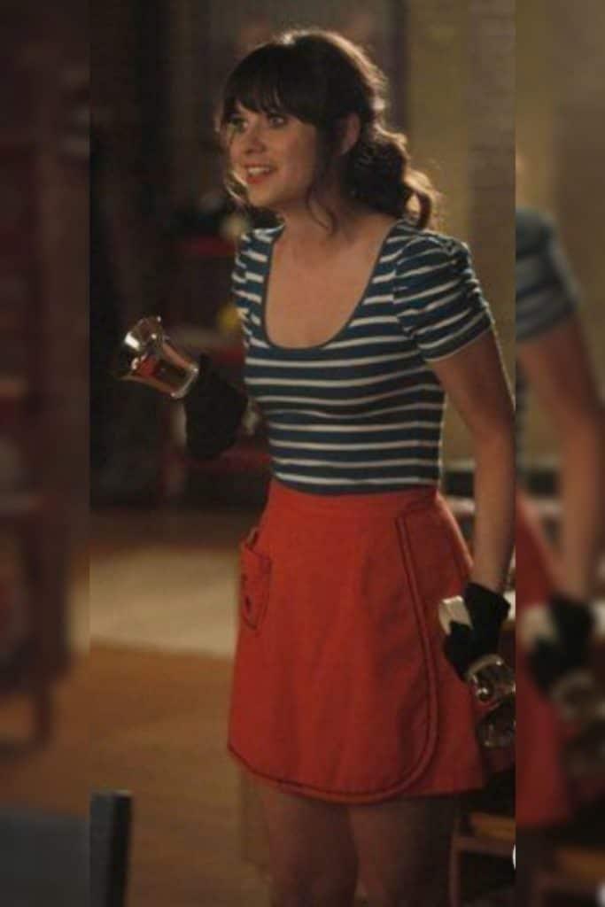 Zooey Deschanel wearing a fit and flare skirt with striped knit top.