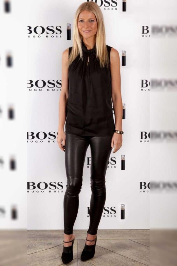 Gwyneth Paltrow wearing a black top with black pants.